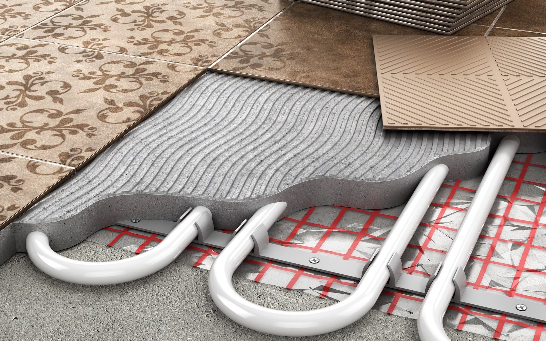 A cutaway of underfloor heating pipes laid beneath floor tiles.