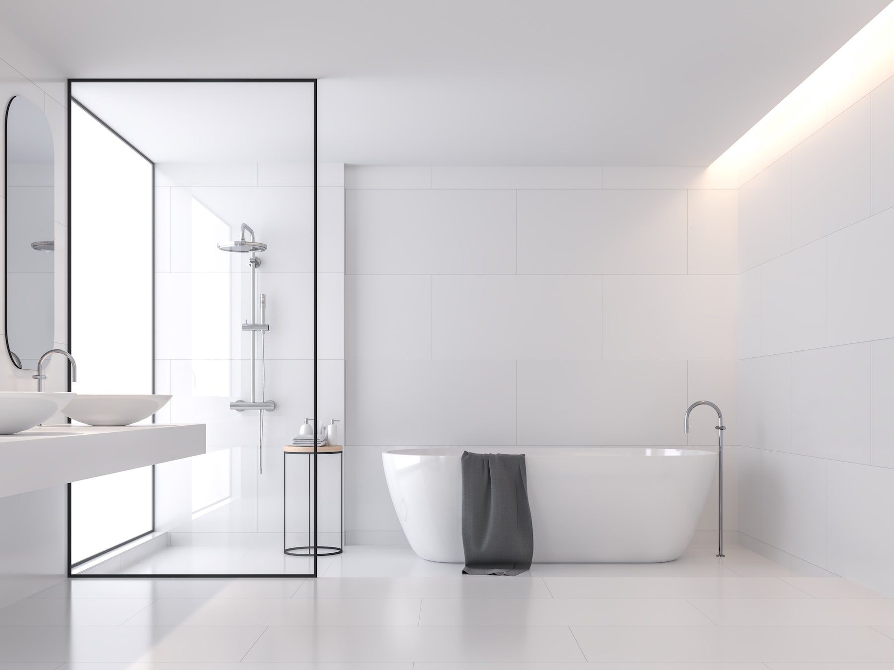 A white bathroom with a freestanding bath and a walk-in shower behind a black-framed glass screen.
